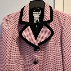 Beautiful pink skirt suit with black skirt.